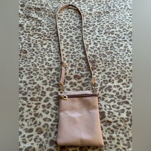 Cross body bag. A cute muted pink.
